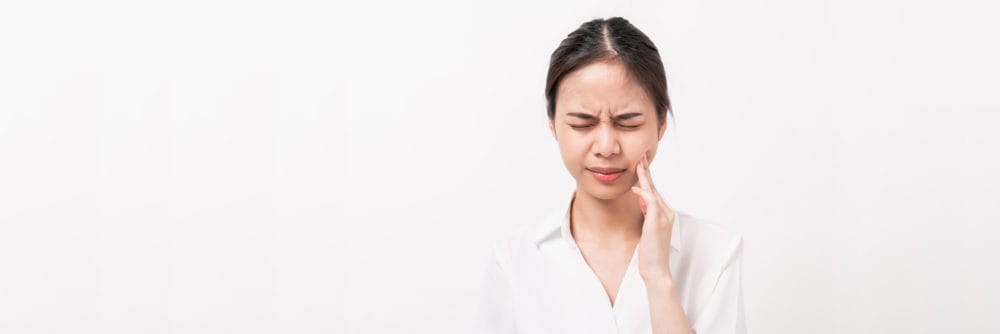 face-of-asian-woman-finger-touches-cheek-maybe-bec-2021-08-31-09-15-55-utc
